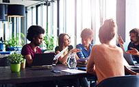 A group of Gen Z employees working on a project.